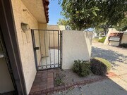 Charming gated front courtyard for added privacy and curb appeal - 1134 W Huntington Dr Townhome