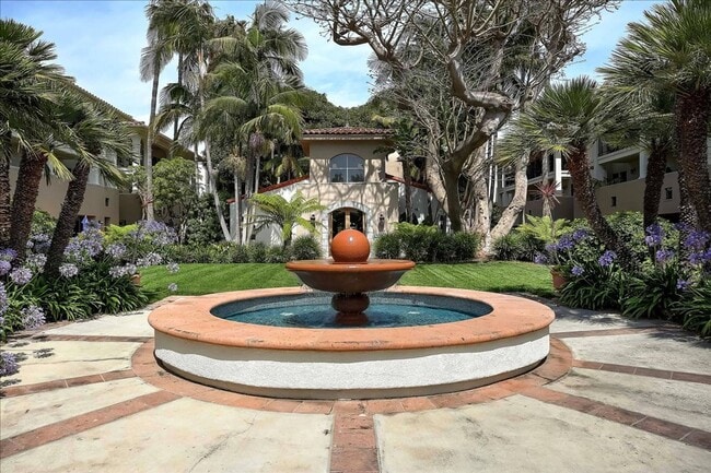 Building Photo - The American Riviera Living at El Escorial Villas