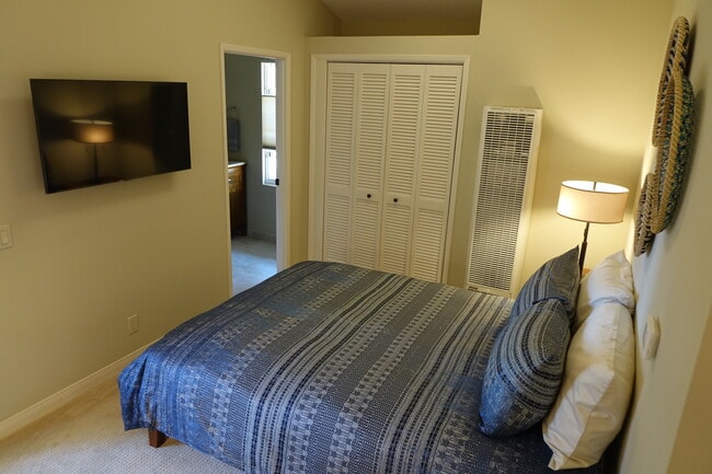 Bedroom with wall mounted 43-inch smart TV - 2620 Tallant Rd Unit Guest House