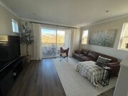 view of living area with view of park in front of home. Upgraded flooring and crown moulding. - 2241 Horseback Rd