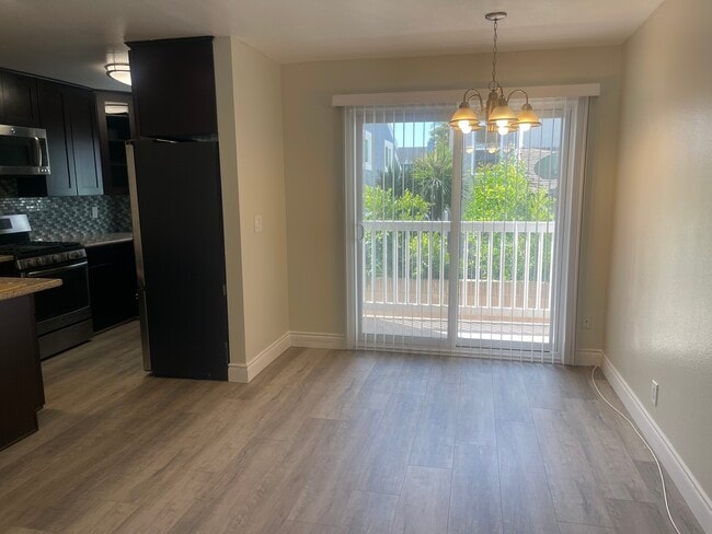 Vinyl slider that opens to a private balcony. - 2411 Prospect Ave Unit 107