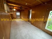 Photo - Beautiful home with large Den, hardwood floors, grassy backyard and dettached 2 car garage.