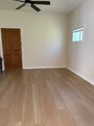 living room looking at door to main kitchen and communal living areas - 305 Emerald St Unit 305