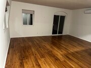 living room with balcony - 8711 Pershing Dr Unit Upstairs