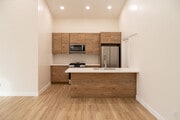 Brand new kitchen- European cabinets, quart cabinets & backsplash, walk thru pantry and new applia. - 4774 Bancroft St Townhome