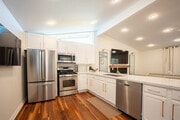 Modern white and gold kitchen - 9962 Pacific Ave