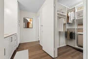 Renovated Package I bath with white cabinetry, beige quartz countertop, and hard surface flooring - eaves South Coast