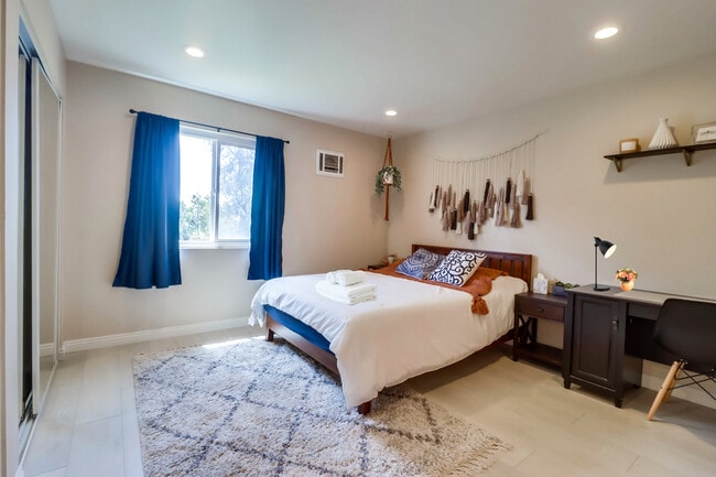 Recharge in this cloud-like queen bed in Bedroom 2 w/ a nearby workspace - 524 Telegraph Canyon Rd Unit G