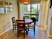 Dine with a view of the tree lined pool. - 4111 Summertime Ln Condo Unit 4111