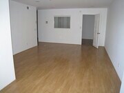 living room showing second room door (den) - 10747 Wilshire Blvd Apartments Unit PH 4