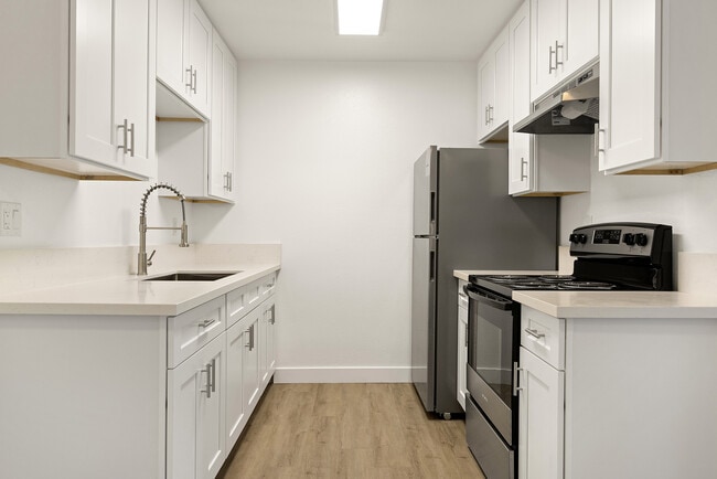 Create meals and memories in your modern kitchen. - View Apartments