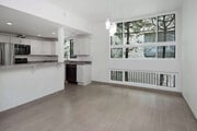 Dining area is open to living room and kitchen. - 10315 Missouri Ave Townhome