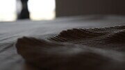 Every bedroom comes with a soft-knit blanket. - 4160 Barrett Rd Apartments Unit Charming Abode