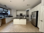 Kitchen with lots of cabinets - 6923 Delaware River Dr House
