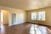 2 BR, 1 BA - Living Room - Petrol East Apartments