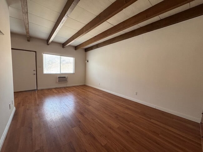 Photo - Large and Bright Studio with wood ceiling beams and floors... Unit Cordova St 216 C