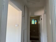 Hallway with linen cabinets. - 10324 Hillhaven Ave House