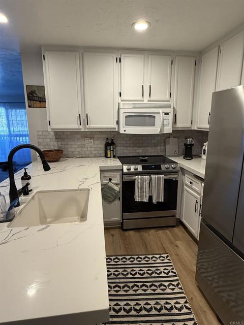 Building Photo - 7704 Caminito Tingo Unit 102