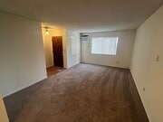 Living room looking toward front door - 3262 Montrose Ave Unit A