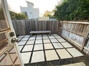 Private yard - looks amazing with some outdoor furniture and plants! - 935 Victoria Ave Unit B