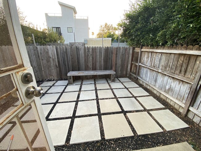 Private yard - looks amazing with some outdoor furniture and plants! - 935 Victoria Ave Unit B