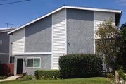 Front of home with yard - 1809 Armour Ln Condo Unit 1