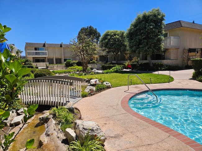 Courtyard view from pool - 1200 Opal St Unit Peppertree Village Condo