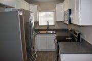 Kitchen w/ Stainless Steel Appliances, Shaker Cabinets, Quartz Countertops - 1170 Fountain St Apartments Unit 7