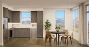 Premium kitchen and dining space with warm wood cabinetry, quartz surfaces, and expansive windows framing hillside views and natural light. - Modera Melrose