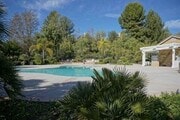 Photo - Located on a cul-de-sac, within the gated ... House