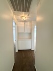 Hallway to bedrooms and bathrooms - 4581 Warner Ave Condo Unit #102