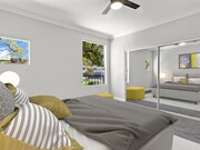 Carpeted bedroom with ceiling fan. - Palms Court Apartments