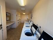 Laundry room - Sandpointe Apartment Homes