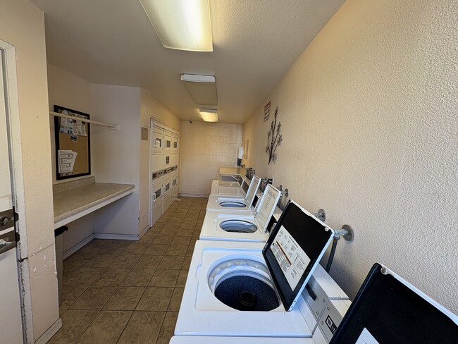 Laundry room - Sandpointe Apartment Homes
