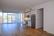 Large living room with open kitchen at 12th Street Lofts in National City, California. - 12th Street Lofts