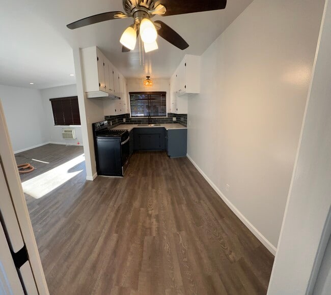 Dining area off kitchen with ceiling fan. - 1016 Western Ave Unit G