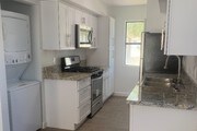Kitchen w Granite Counters & SS Appliances - 73530 Catalina Way Apartments Unit info@twelve14.com