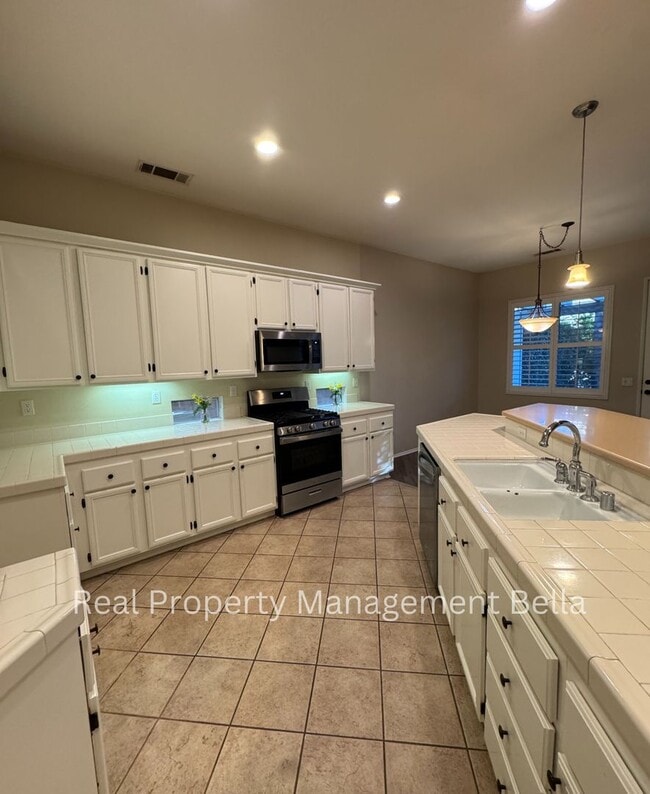 Photo - Charming 3-Bedroom Home with Open Floor Plan and Covered Patio