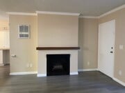 gas fireplace and front door - Bay Timbers Apartments