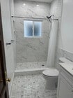 walk in shower marble look - 232 N Clark Dr