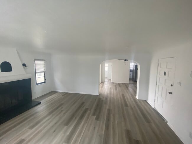 Living room with decorative fire place - 2702 W 43rd Pl Apartments Unit 2702