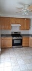 Eat-in Kitchen with 5 burner natural gas range and oven. - 314 20th St Unit D