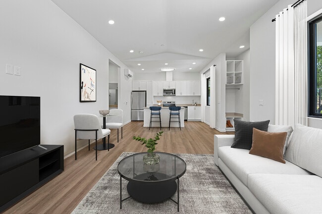 Freestanding Home dining and living room with hard-surface flooring - eaves San Marcos