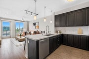 Kitchen, living, and dining area - AVA Balboa Park Apartments