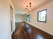 Dining area looking towards living room and front door, kitchen entrance is the door on the left - 14501 W Sunset Blvd
