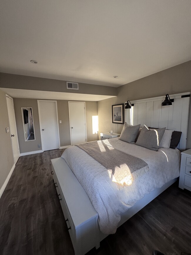 Primary bedroom with walk-in closet and secondary closet - 22100 Burbank Blvd Unit 333