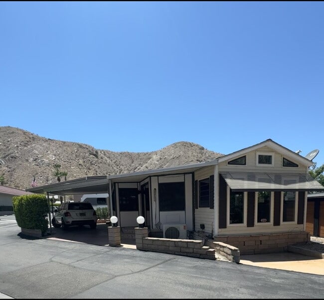 Building Photo - Peaceful Desert Retreat in Gated 55+ Community | Corner Lot with Double Entry Driveway Unit Space 216