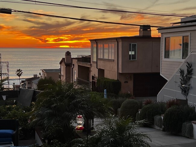 sunset from our walkstreett - 323 31st Pl Unit APT