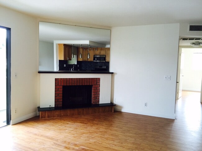 fireplace in living room - 10740 Lawler St Unit #4