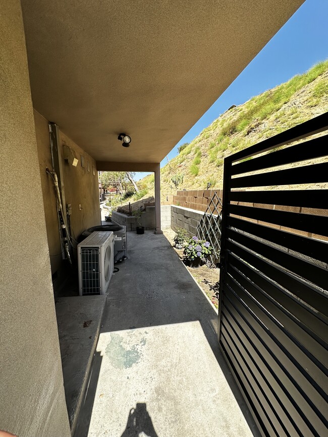 Covered area for water and dryer hook up - 8532 Vine Valley Dr